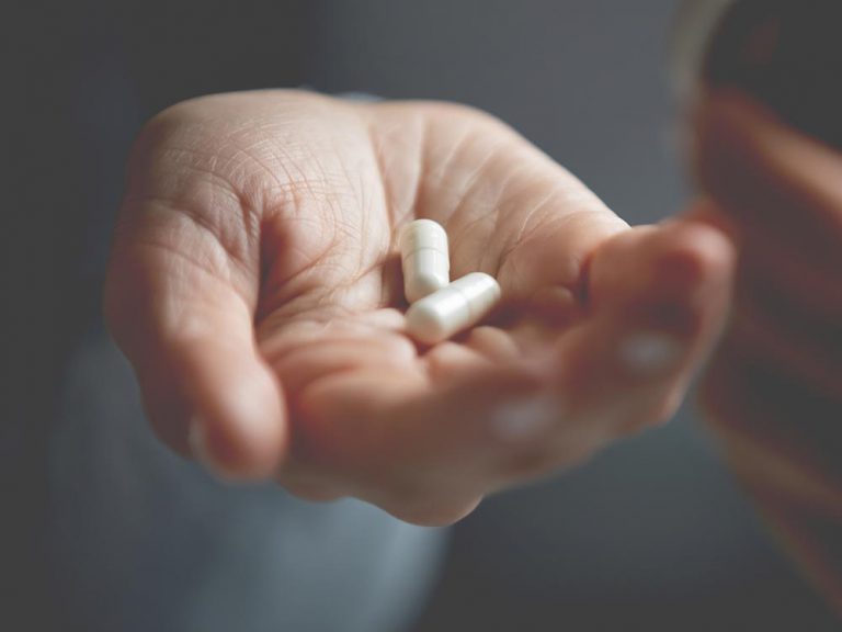 Is it took late? (picture of white person's hand with two white pills)