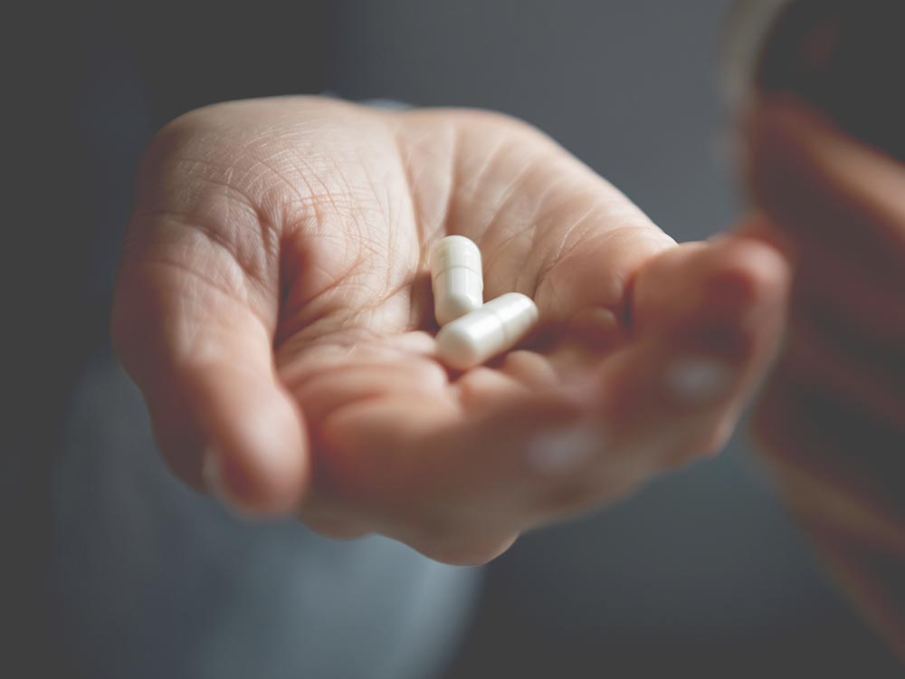 Is it took late? (picture of white person's hand with two white pills)
