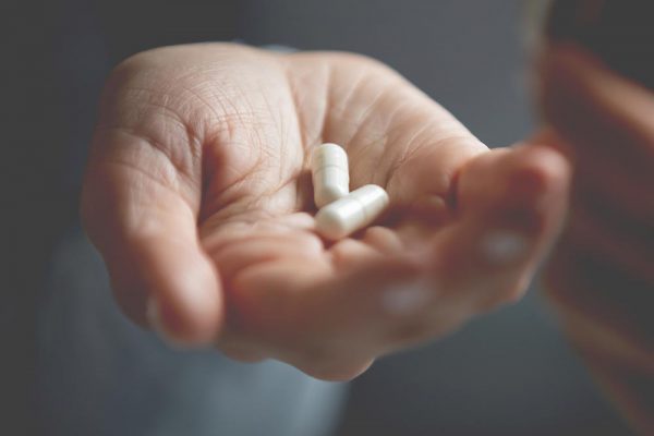 Is it took late? (picture of white person's hand with two white pills)